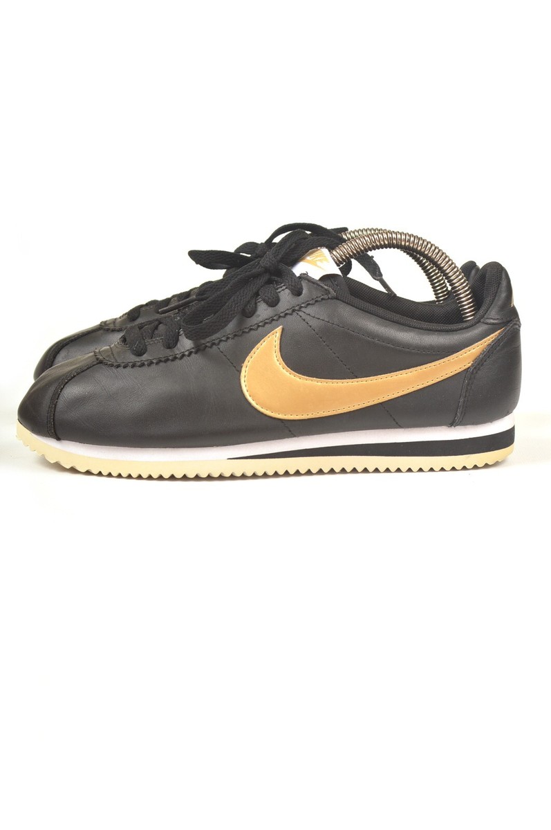 black and gold cortez shoes