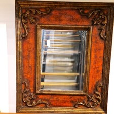 Rectangular wooden frame with carvings in the corners, lacquered