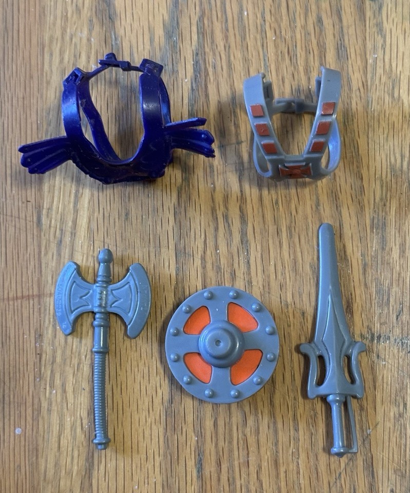 Original 1981 Taiwan-made He-Man weapons and Skeletor chest plate — the OG MOTU accessories before the franchise exploded.