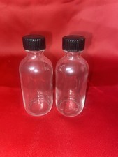 2 oz. Clear Boston Round Glass Bottles with black threaded caps Set Of 2