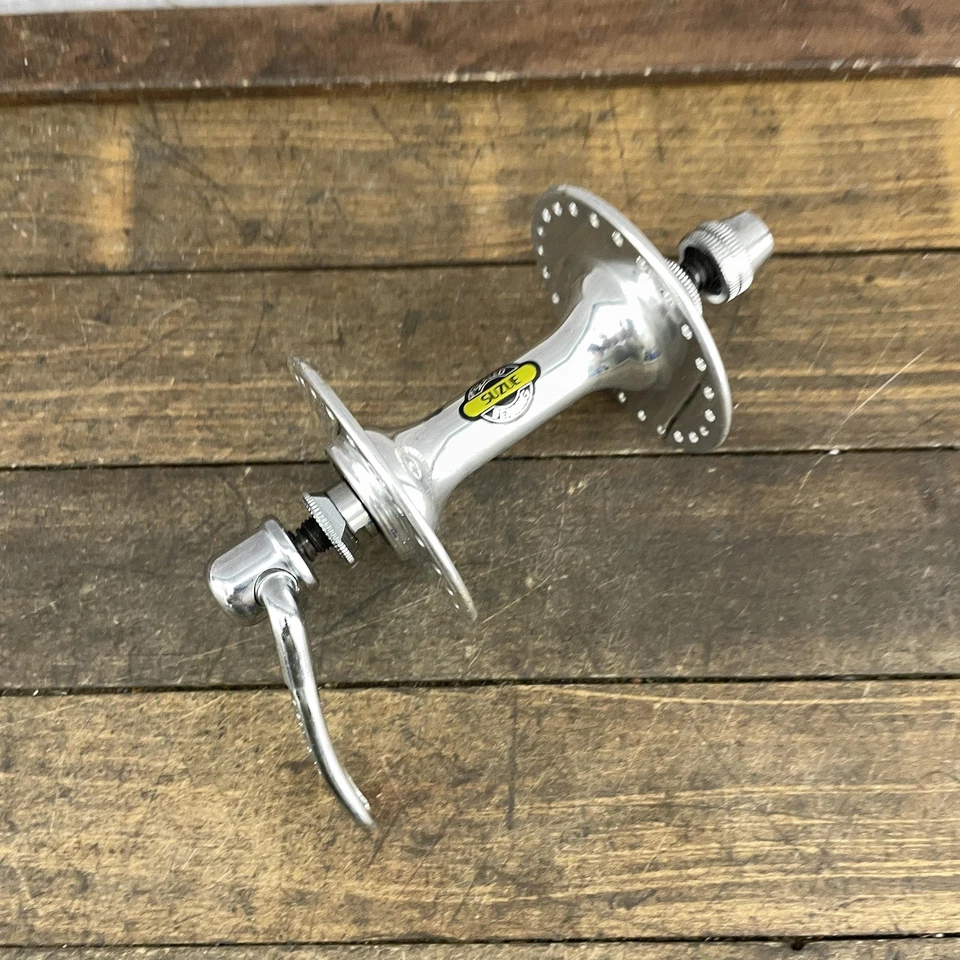 Buje Delantero Suzue 48H Brida Alta Cojinete Sellado Nuevo de Lote Antiguo Liberación Rápida Plateado Foto 2 de 4