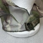 Close-up of Vtg Camo hunting mosquito net with green and brown camouflage pattern and textured mesh fabric.
