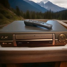 LG AC200i VHS Player with remote and 14 VHS tapes included 