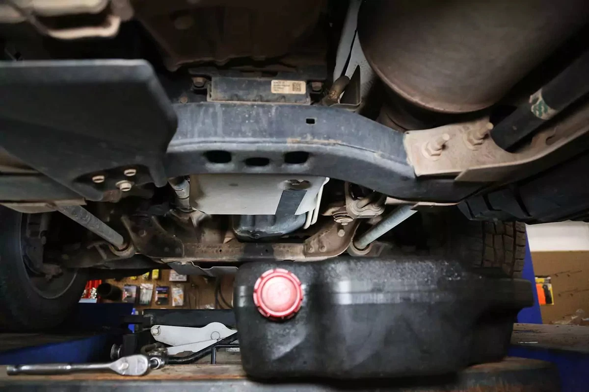 A drain pan positioned under the automatic transmission drain plug.
