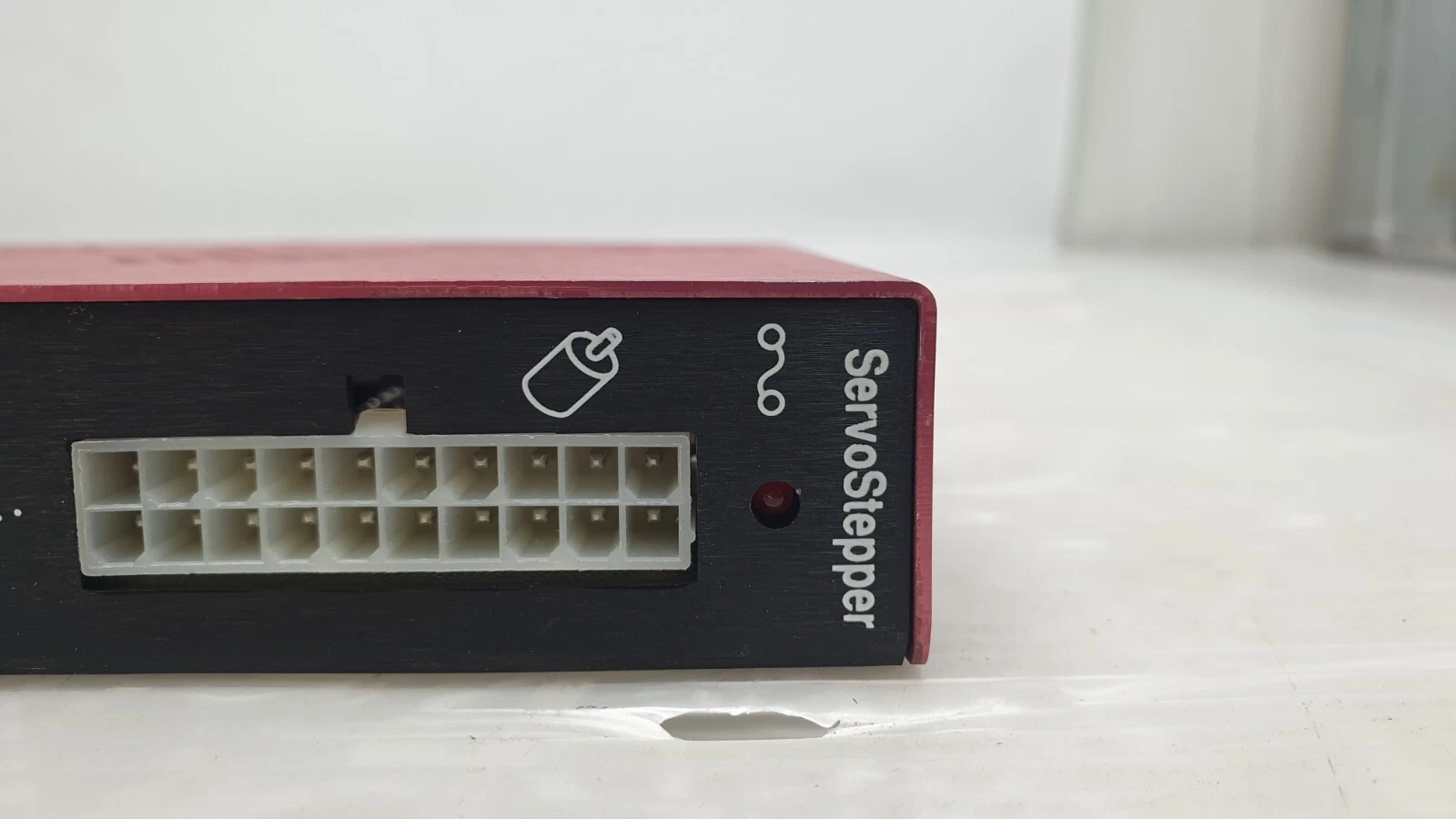 ServoStepper end of the Teknic SST-1500-103 with 16-pin connector and LED