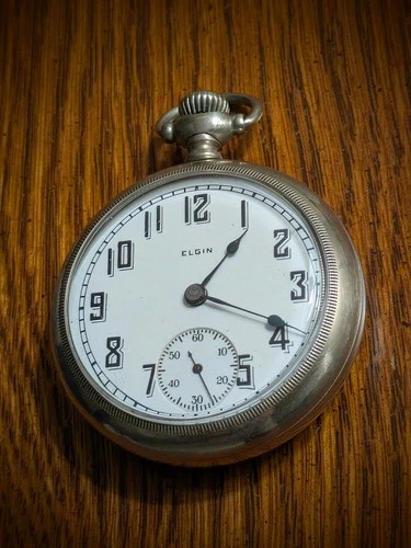 Remarkable antique Elgin pocket watch.  Sticker on back says $190 and dated 1935