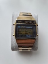 This is a vintage gold-tone Seiko A159-5019-G digital LCD watch.