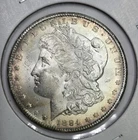 Toned 1884 CC Morgan Silver Dollar UNC