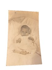 Vtg Snapshot Photo Baby In Formal Dress Grumpy Sleepy Showing Her Fists 1950s