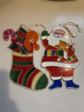 2 Vtg J.S.N.Y. Christmas Plastic Stained Suncatchers / SANTA & FILLED STOCKING