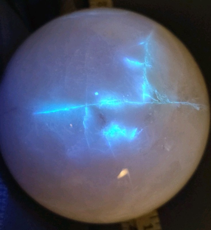 Massive 97mm UV-Reactive White Calcite Sphere - Electric Blue Lightning