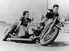Motor engineer Mr H Jenneret and a passenger try out his new motor- Old Photo