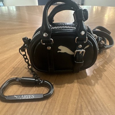 PUMA  X Aries Mini Grip Clutch Womens