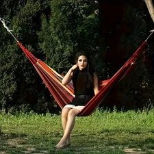 Patio leisure striped hammock, with a sturdy design ensuring worry-free weight b