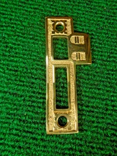 BRIGHT BRASS EASTLAKE 3 5/8" PASSAGE DOOR STRIKEPLATE - STYLE #2   (33233)