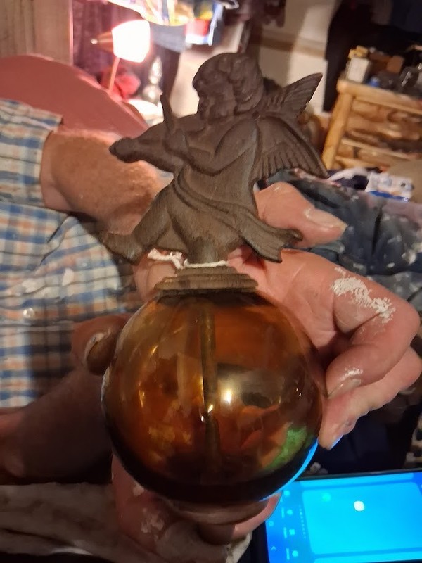 Vintage cast iron cherub perched on amber glass orb hollywood regency style 7 "