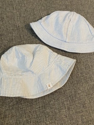 2 Baby Hats Striped Hat Has A Strap and The Other Hat Is A Mayoral Hat