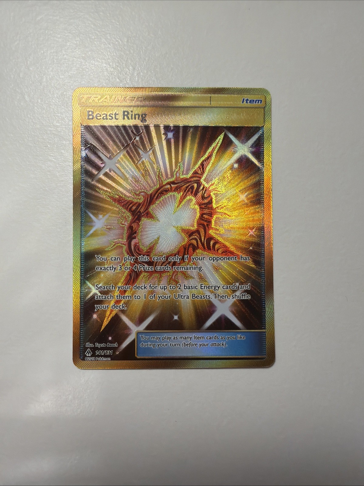 Pokemon Beast Ring 141/131 Secret Rare Sm-Forbidden Light Holo Energy Nm