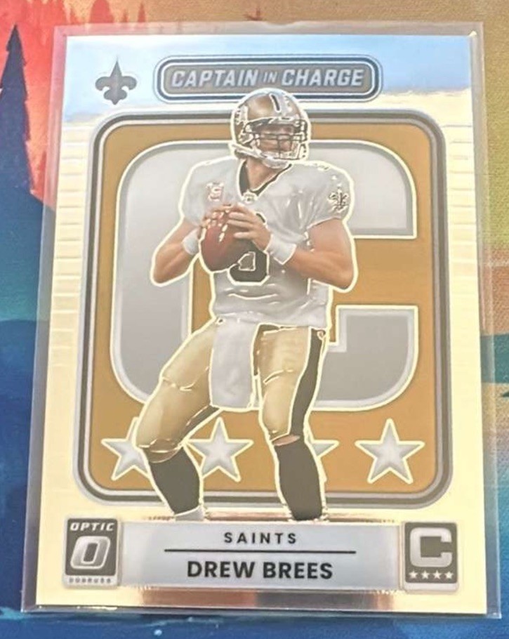 Drew Brees #8 (Football Cards 2025 Panini Donruss Optic Captain in Charge) — is it worth grading?
