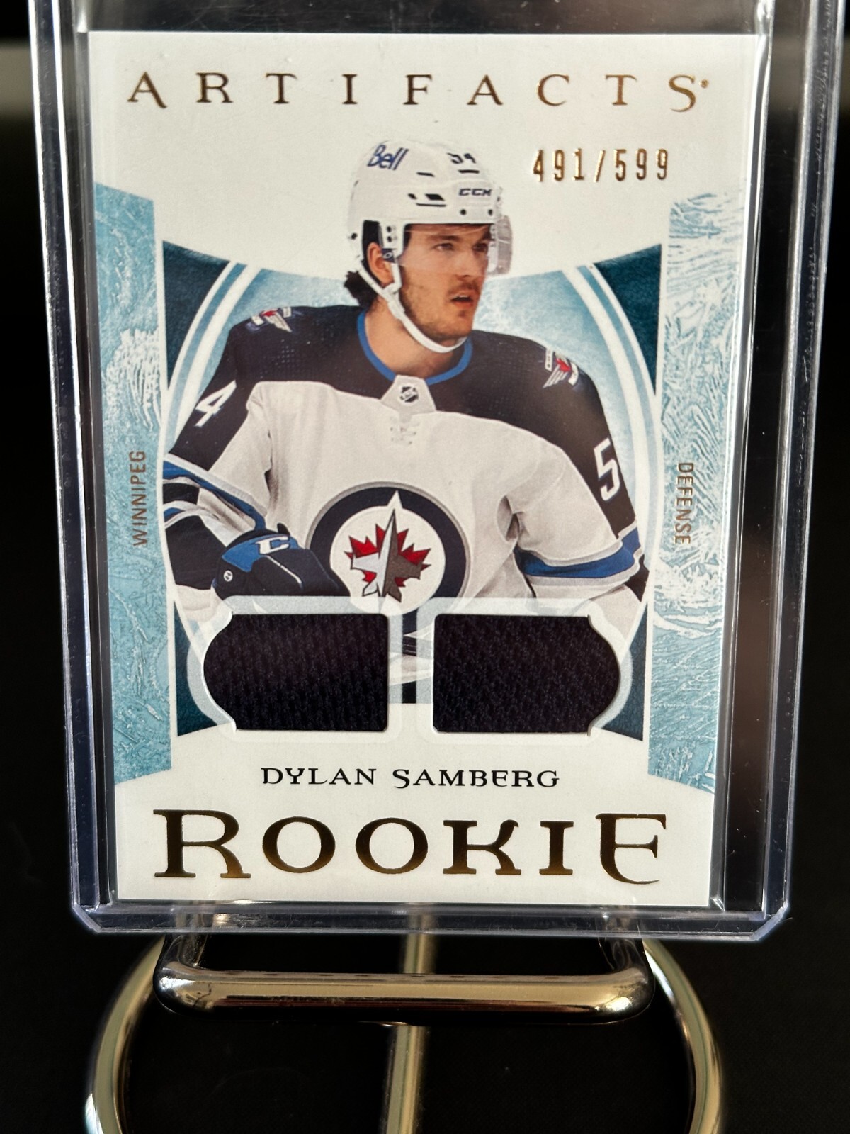 22-23 UD Artifacts - Rookies Gold Material Relics #187 Dylan Samberg /599 - Jets