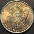 1884-O MORGAN DOLLAR GOLDEN TONED UNCIRCULATED