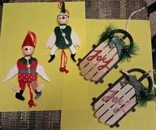 4 VINTAGE LARGE WOOD ORNAMENTS 2 SLEDS, 2 PULL-STRING JUMPING JACKS