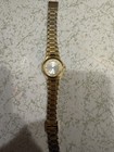 Caravelle by Bulova Quartz Gold Tone Bracelet Watch Silver Dial Date Roman — photo 1