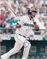CARLOS PEGUERO   SEATTLE MARINERS   ACTION SIGNED 8x10