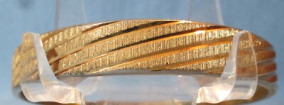 Elegant BANGLE BRACELET Designer Signed MONET Gold Tone Cut Design