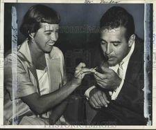 1965 Press Photo Ernie Ford's cigarette lighted up by his wife Betty ford