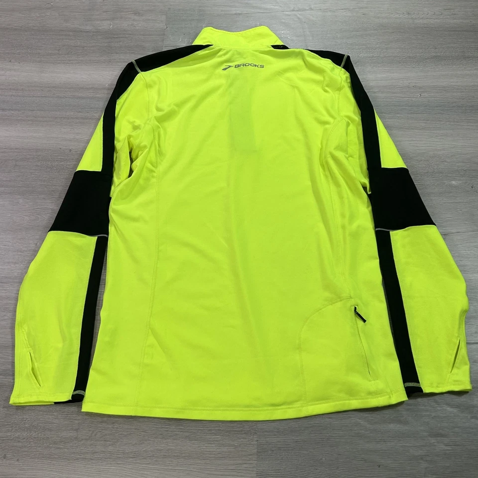 Pullover Brooks para correr para hombre medio amarillo negro 1/4 cremallera reflectante agujeros para los pulgares Foto 2 de 4