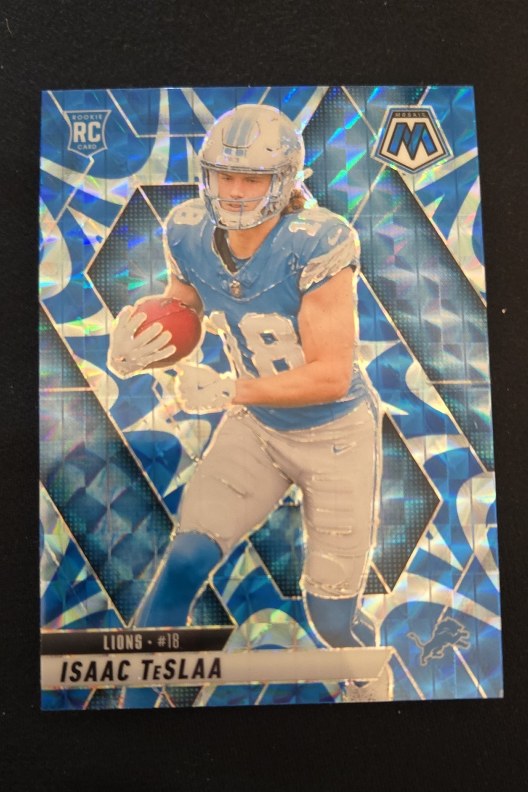2025 Panini Mosaic - Isaac Teslaa RC #319 Reactive Blue Mosaic Prizm