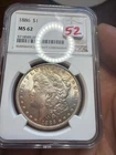 Slightest of toning. 1886 Morgan Dollar NGC MS62. Item No 52