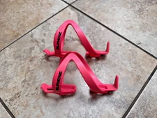 A Pair Of Supacaz Fly Bike Bottle Cage Neon Pink