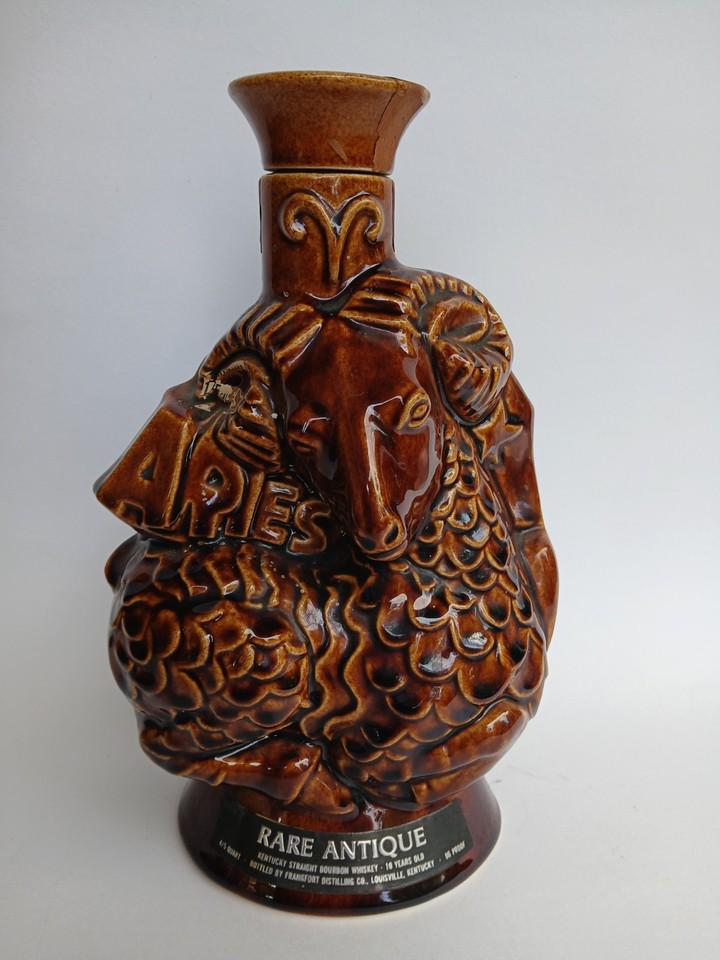 A 1970s astrology whiskey decanter featuring Libra and Aries — equal parts vintage barware and quirky cosmic artifact.