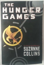 "The Hunger Games" by Suzanne Collins, paperback, like new