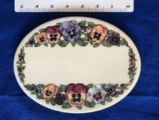 Santa Barbara Ceramic Design oval plaque with pansies - 8.12" W x 6.25" H