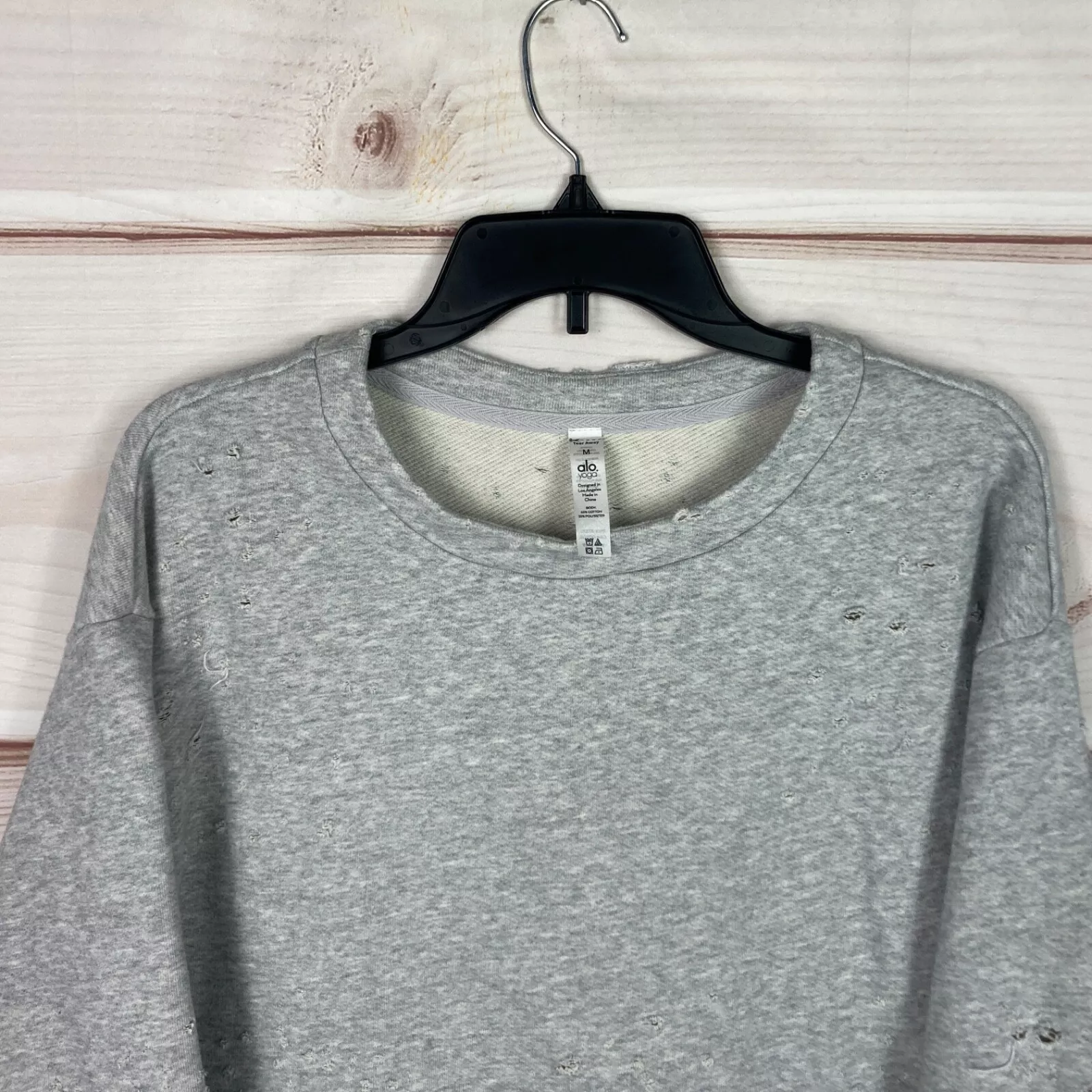 alo-yoga fierce distressed cropped long sleeve pullover sweatshirt