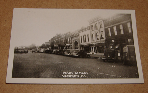 c1940 Main Street Warren Illinois RPPC vista città IL - Foto 1 di 3