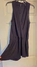 BCBGMAXAZRIA Black Shorts Romper Featuring A Draped Bodice and Cinched Waist. M