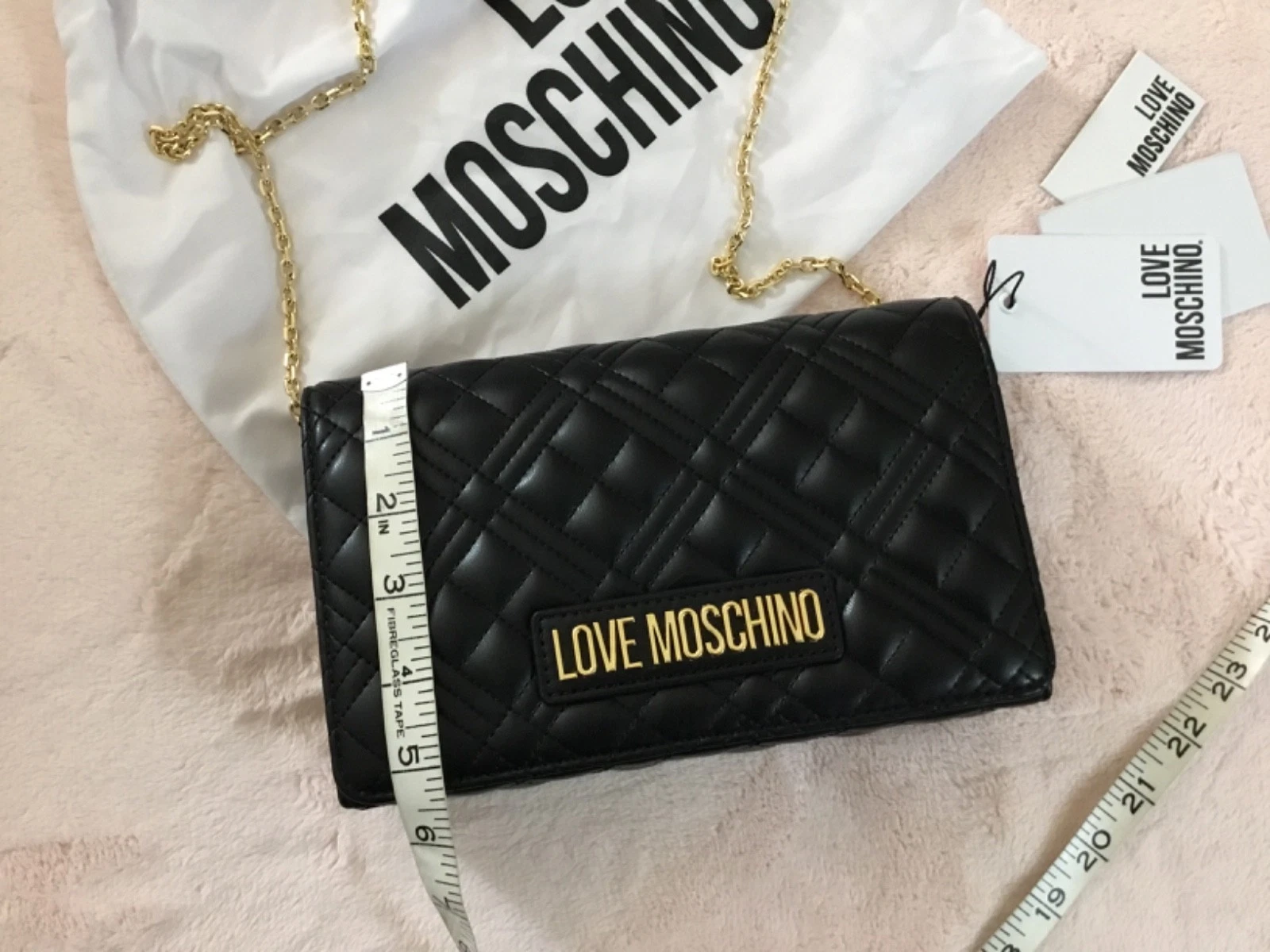 Love Moschino Borsa pochette trapuntata a tracolla con tracolla a catena nero oro