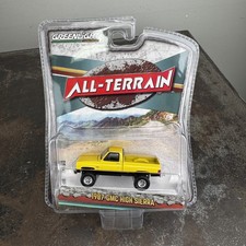 GREENLIGHT 1987 GMC HIGH SIERRA All Terrain 1:64 NEW Yellow