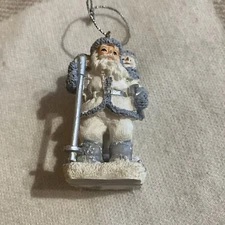 The Encore Group White Blue Santa Powder Snowman Skiing Christmas Tree Ornament