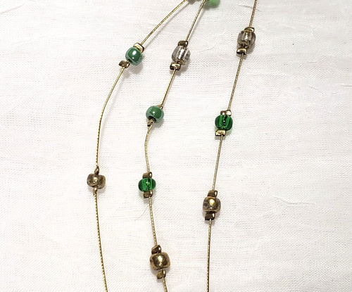 NY & Co 3 Strand Gold Tone Necklace w/Goldtone Heart & Green, Clear & Gold Beads - Picture 9 of 9
