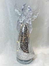 Northlight 12" Lighted Christmas Angel Holding Star Figurine in Clear Silver