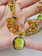 Silver tone necklace with green and yellow