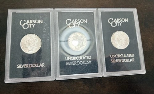 3 Coins. 1882,1883,1884 CC Morgan Dollar Brilliant Uncirculated - GSA Holder