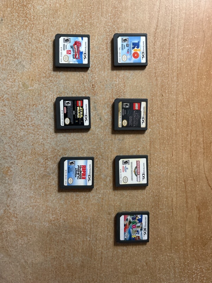 nintendo 2ds xl consoles with nerf cases and games and chargers along