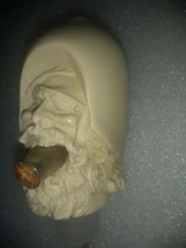 Folk Art Bottle pourer , Viking bitting bullet.