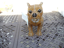 Beaded land: Golden Staffordshire Bull Terrier
